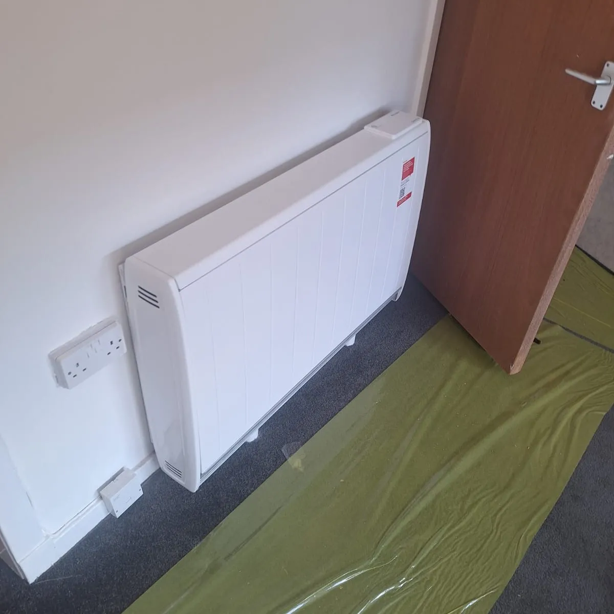 PW-19-Electri-Storage-High-Heat-Retention-Installation-d Wall mounted electric storage high heat retention system