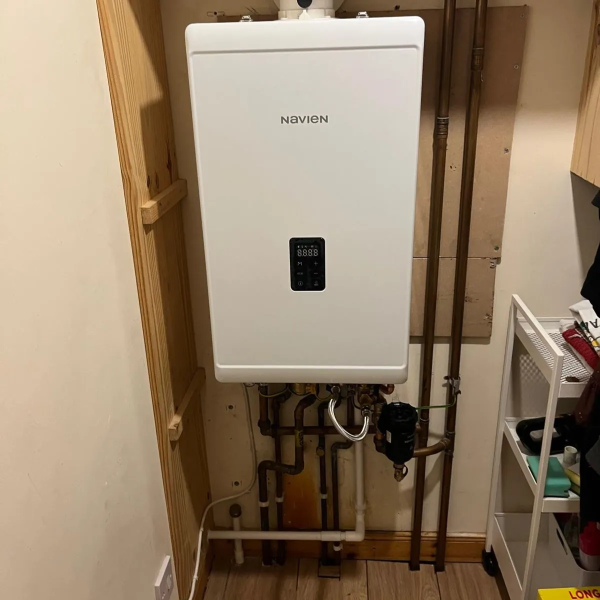 A new Navien boiler installed in a cupboard